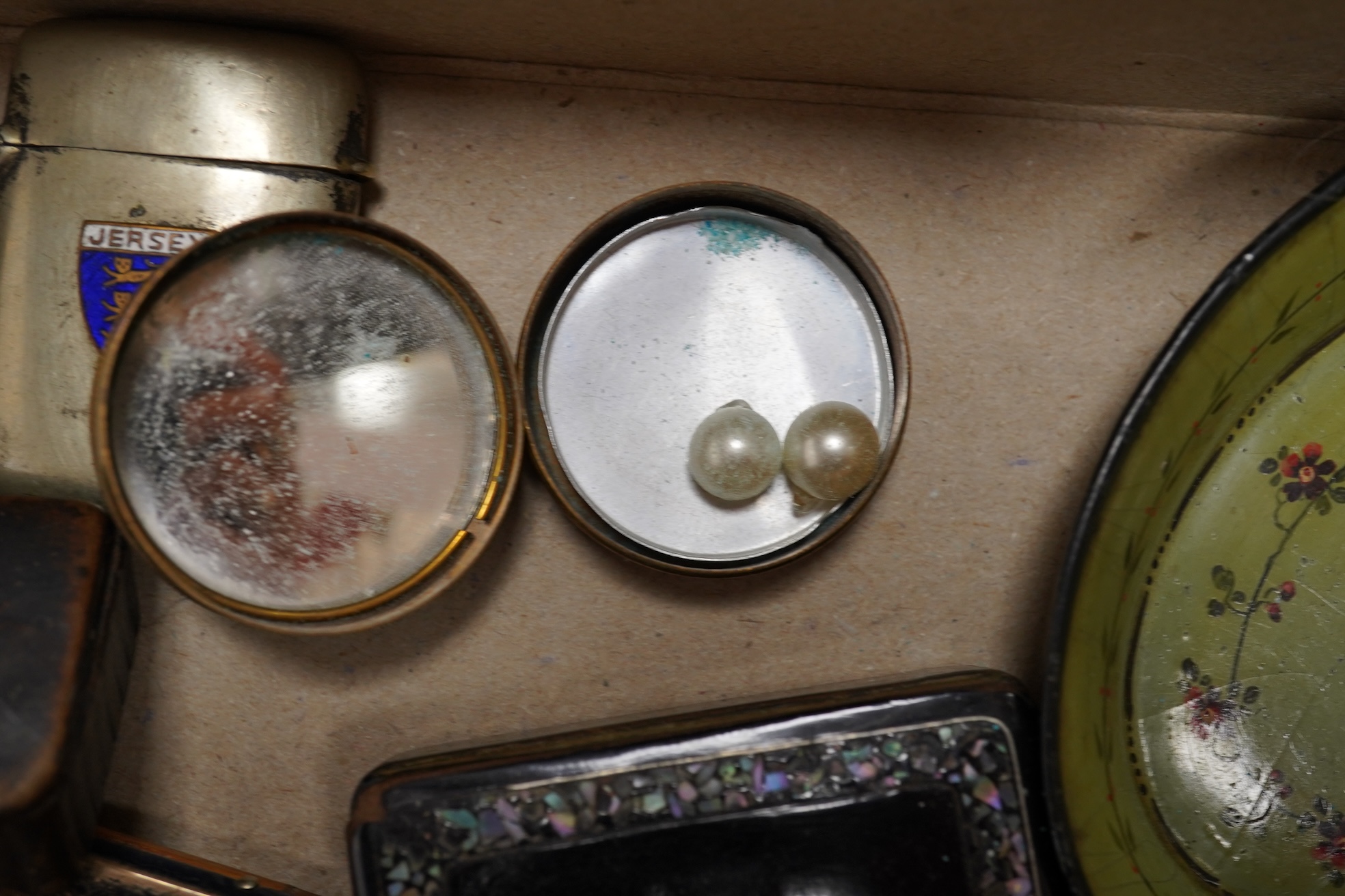 A collection of objects of vertu including snuff boxes, a pair of miniature oval trays, a silver mounted clock and photo frame, etc.